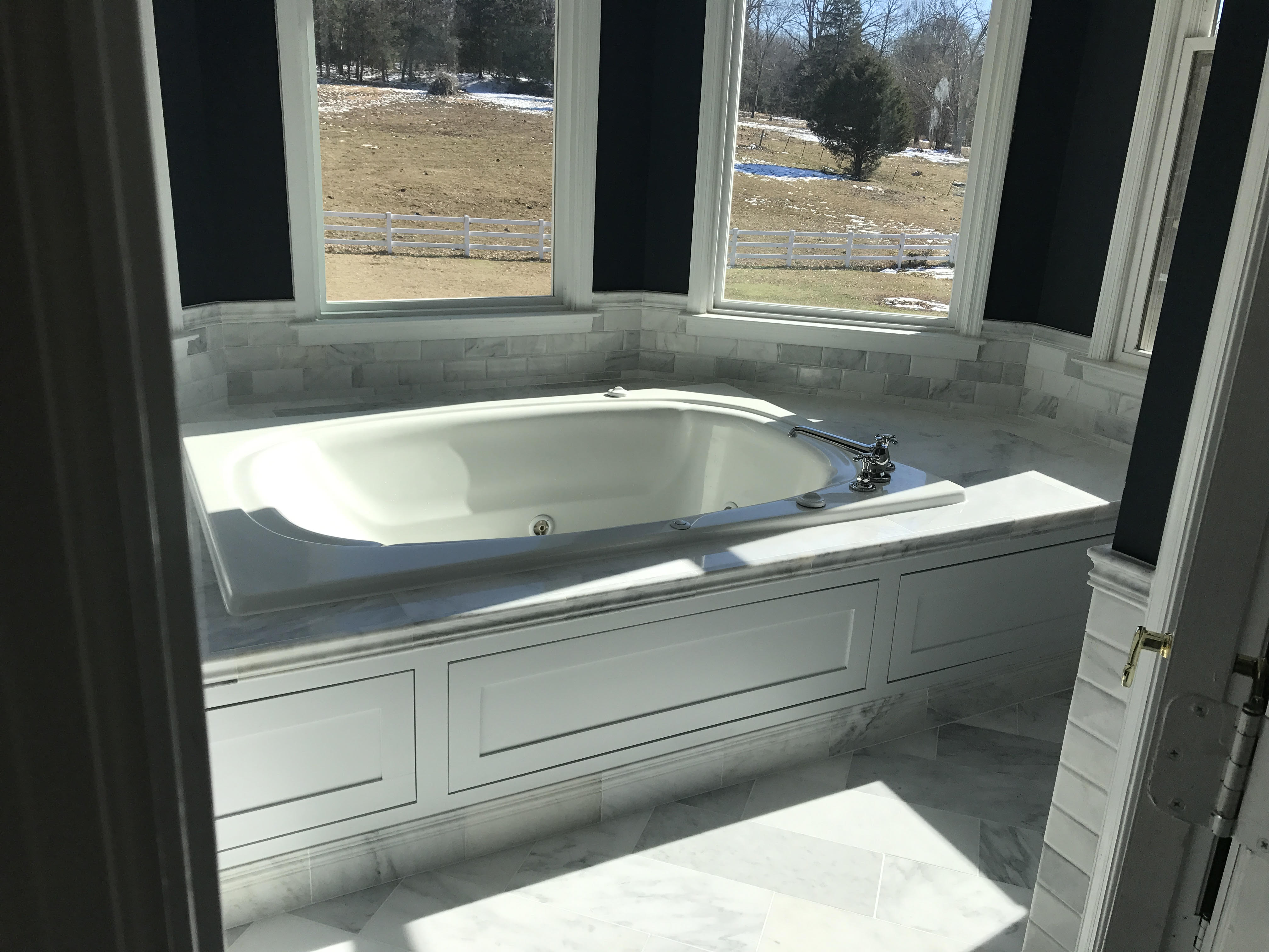 Corner Whirlpool Tub with Custom Surround