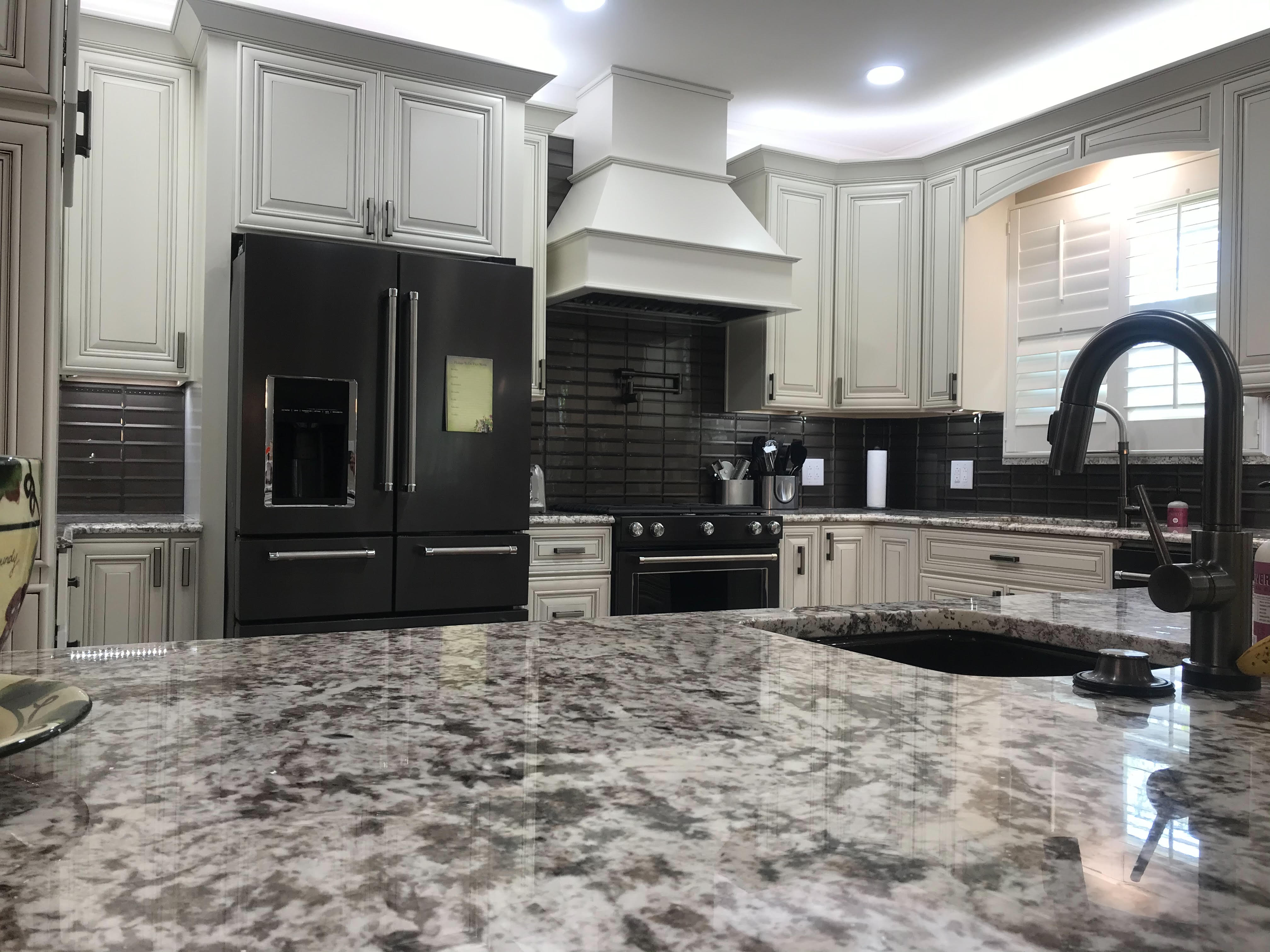 Traditional Kitchen with Black Tile Backsplash
