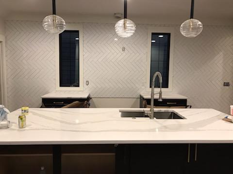 Kitchen Bar with Herringbone Tile Wall